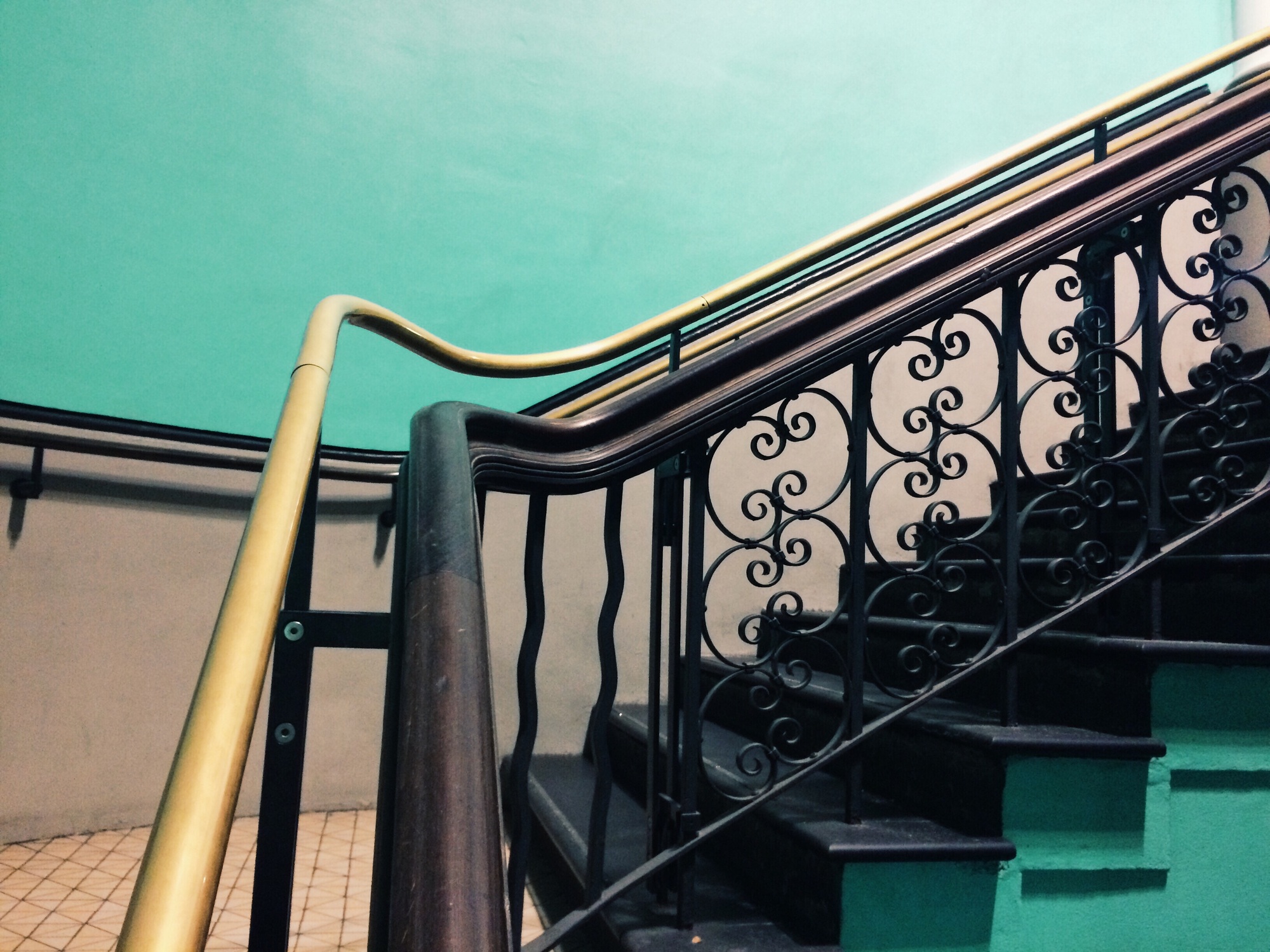 Historical stairs with a golden rail